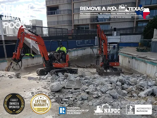 Step 4 - Excavator starting demolition of the shallow part of the swimming pool - Remove A Pool Dallas Fort-Worth Texas - Remove A Pool DFW