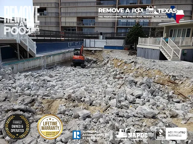 Step 8 - Inspecting the deep end of the pool near hotel buildings - Remove A Pool Dallas Fort-Worth Texas - Remove A Pool DFW